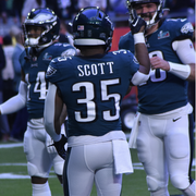 Bradon Scott passed a football before the Super Bowl