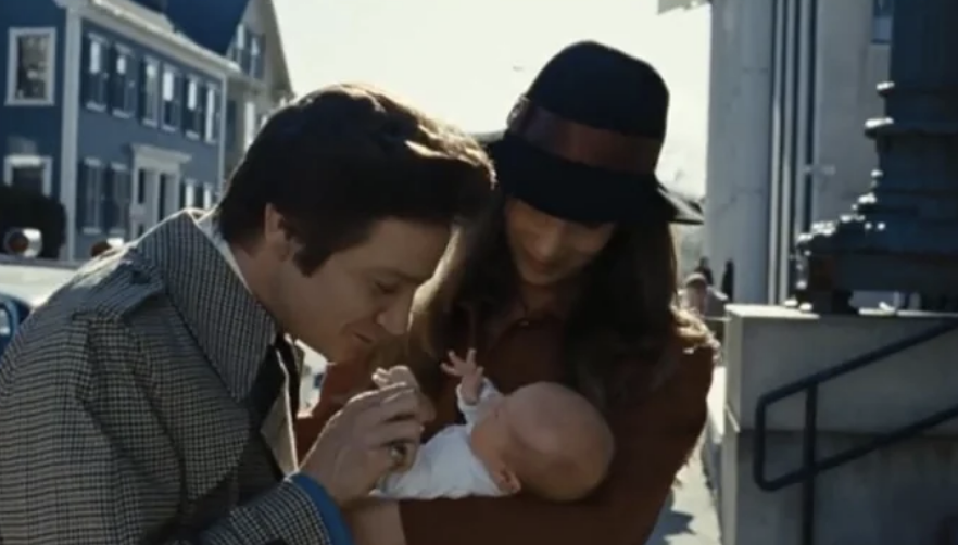 Carmine touching the baby