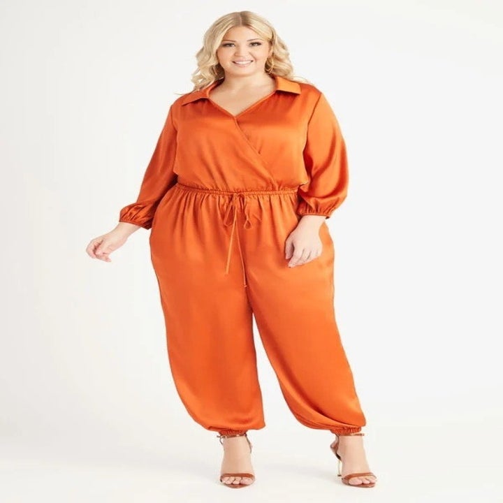 model wearing the orange jumpsuit