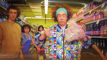 GIF of Fred Armisen on Portlandia spilling a bag of colorful cereal everywhere