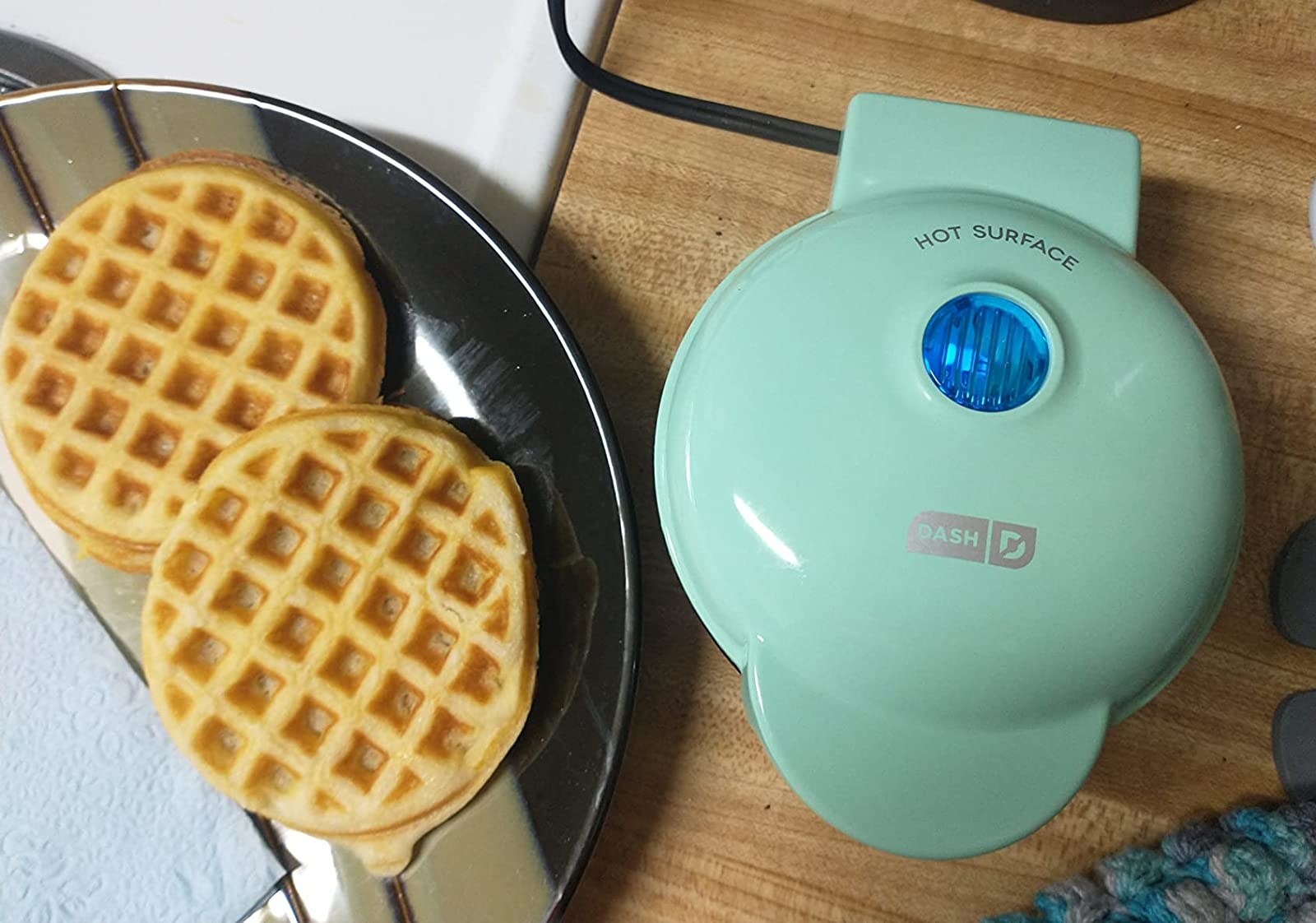 Reviewer&#x27;s photo of the mini waffle iron in the color Aqua