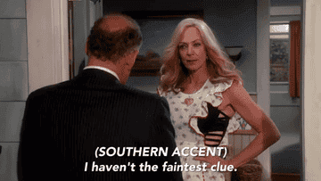 woman answering the door and subtitles read that she&#x27;s speaking in a southern accent, saying, &quot;I haven&#x27;t the faintest clue&quot;