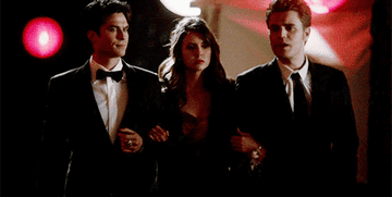 damon elena and stefan from the vampire diaries walking hand in hand