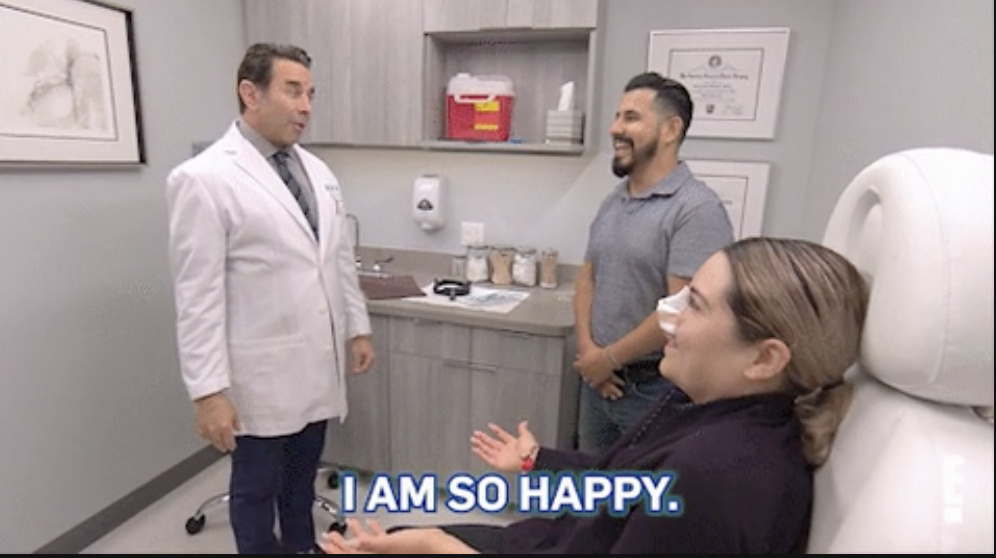 a woman in a surgeon&#x27;s office saying, &quot;i am so happy.&quot;