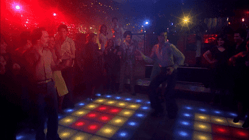 John Travolta dancing at a disco club in Saturday Night Fever
