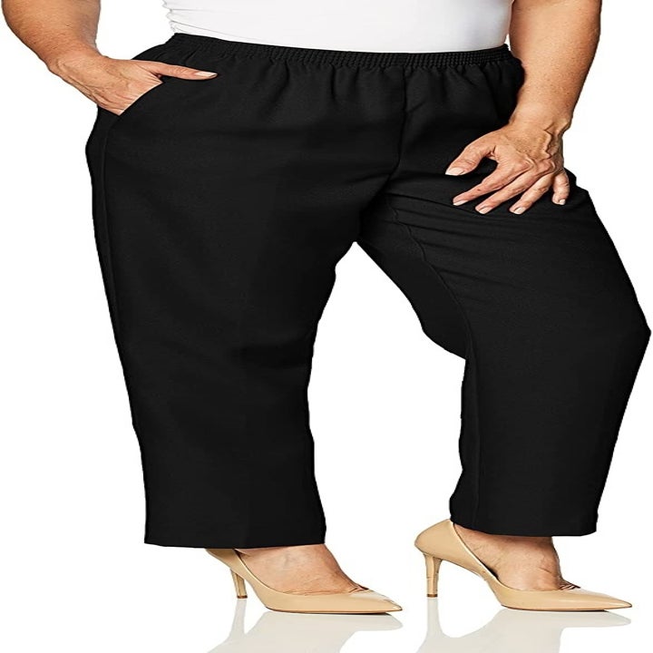 front view of model wearing the black trousers