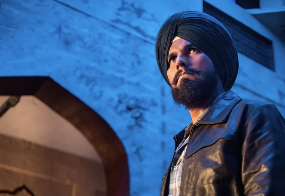 Randeep Hooda, wearing a turban and a leather jacket, in a still from the show