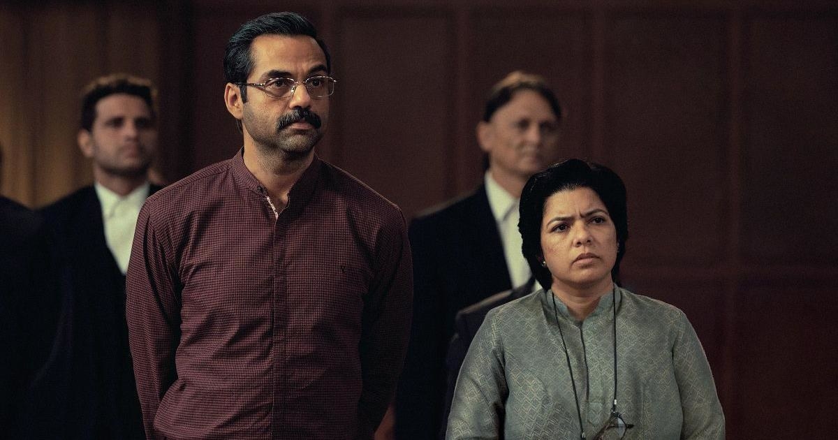 Abhay Deol and Rajshri Deshpande in the courtroom, standing in front of lawyers