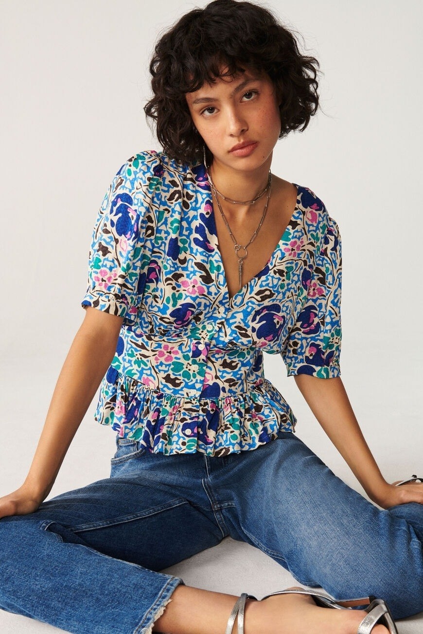 model wearing multi-color patterned shirt