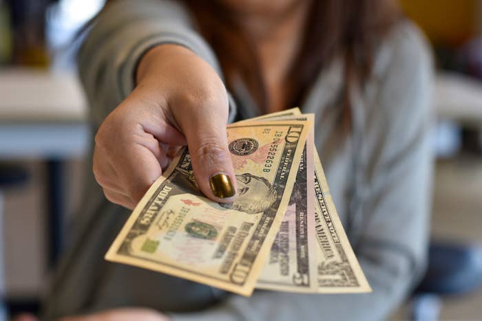 hand holding cash out
