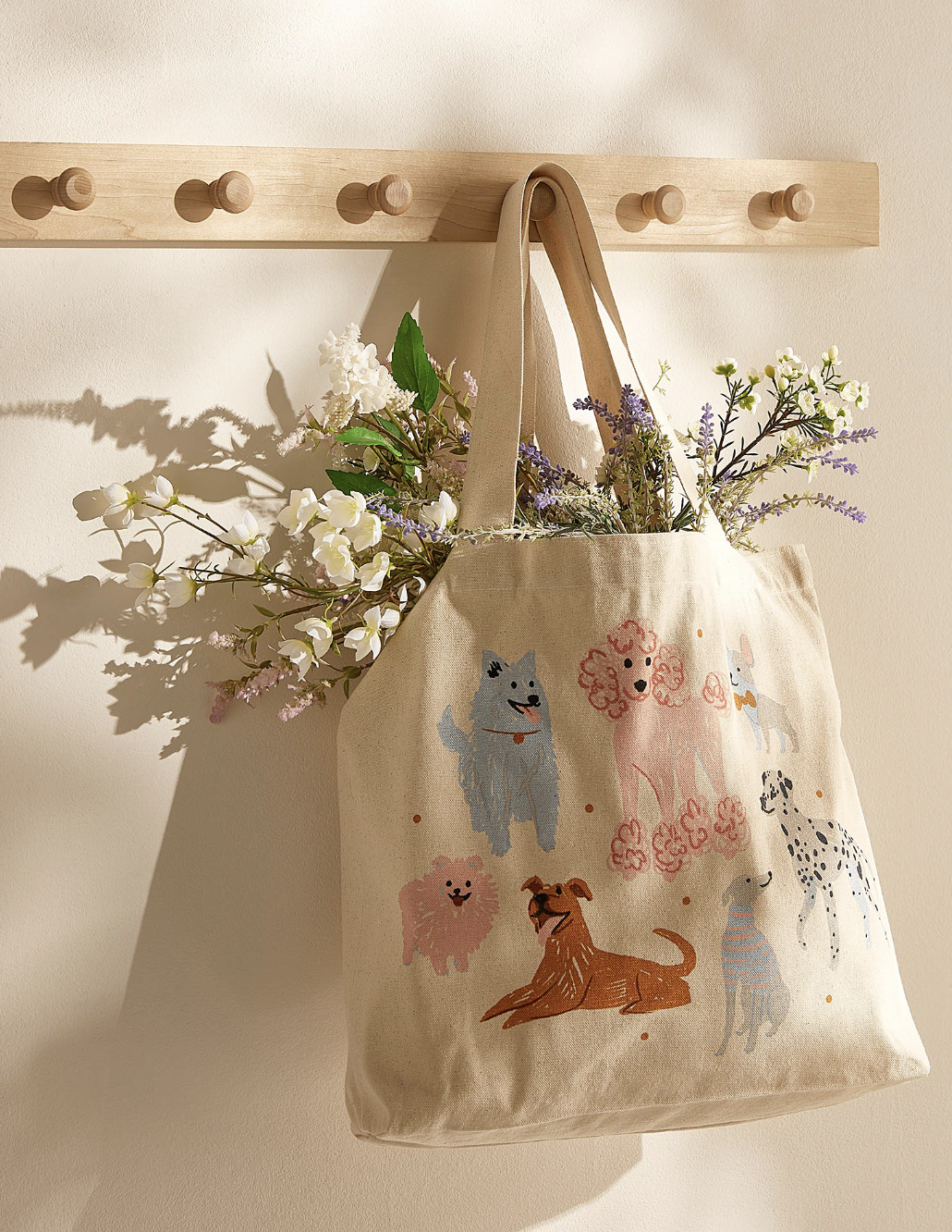 the tote hanging on the wall filled with flowers