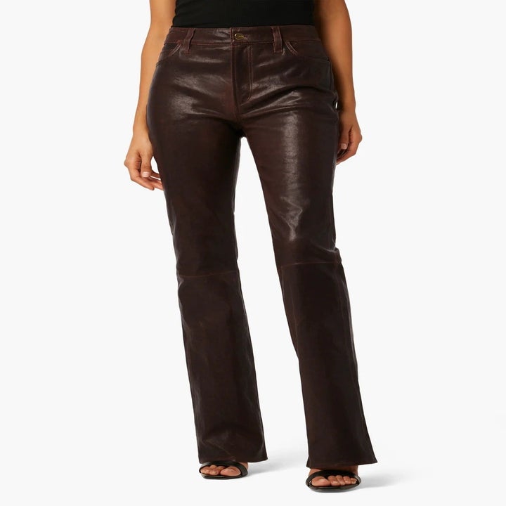 model wearing brown leather jeans