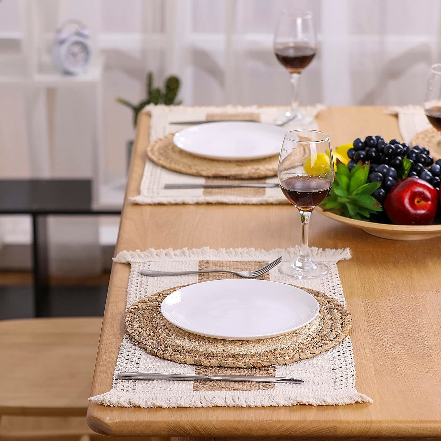 the place mats and napkins placed on a table with plates and cutlery