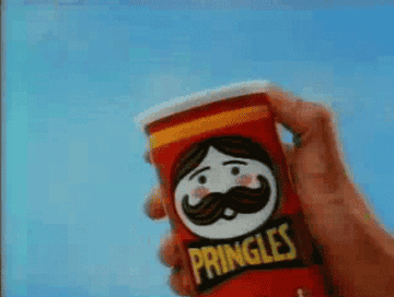 Someone pops the top off a can of Pringles