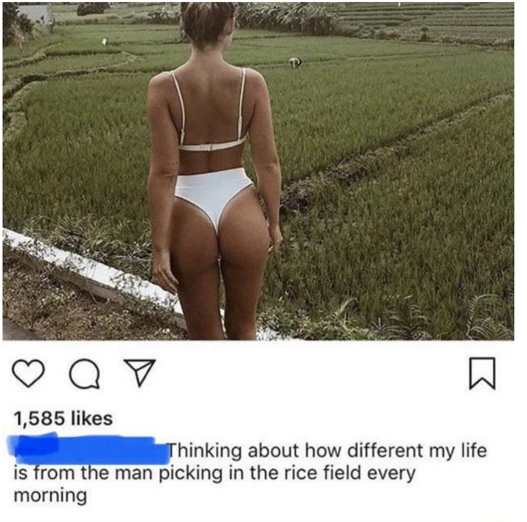 A woman posing for a bikini photo with a man picking rice in the background