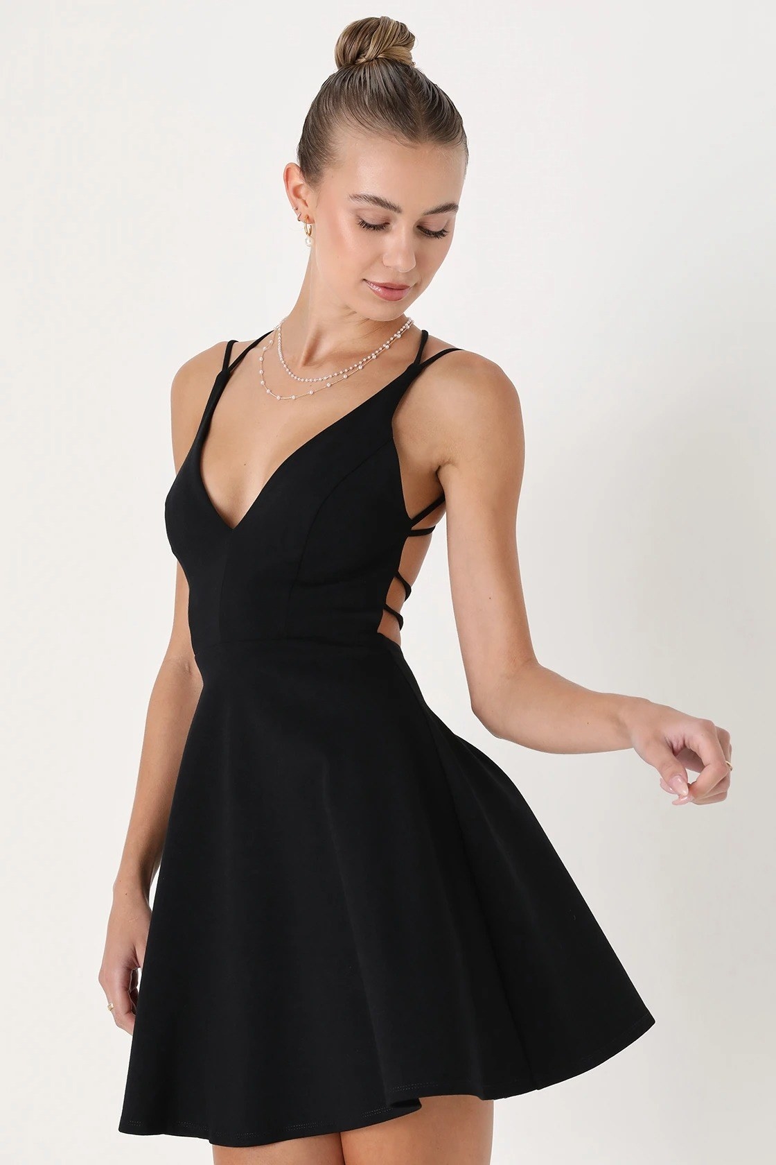 model wearing the black skater dress