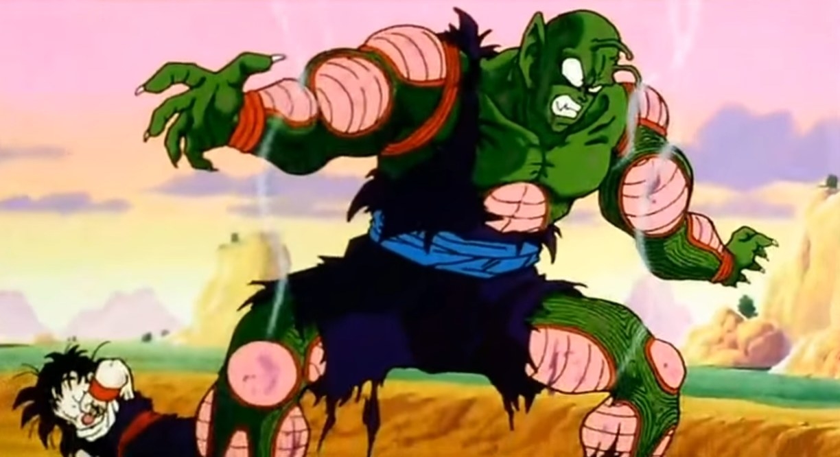 A damaged Piccolo standing in front of Gohan after getting hit by something
