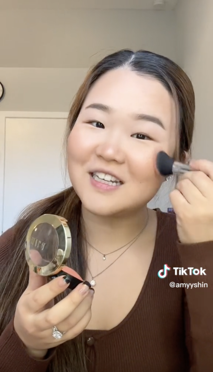 Amy applying makeup