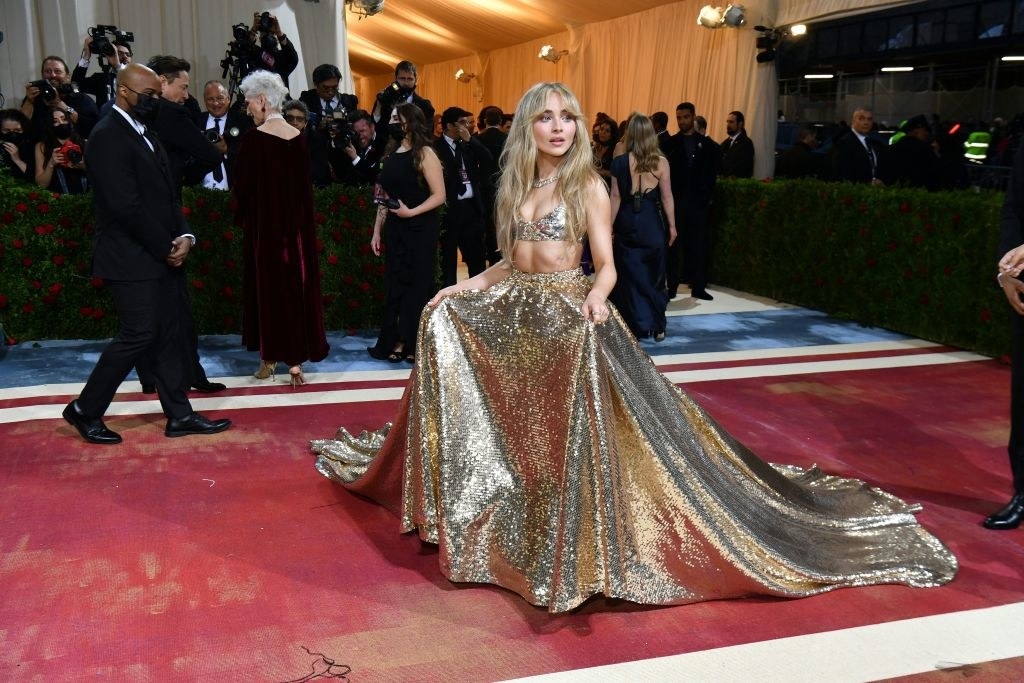 Sabrina Carpenter in a gold outfit at the 2022 Met Gala