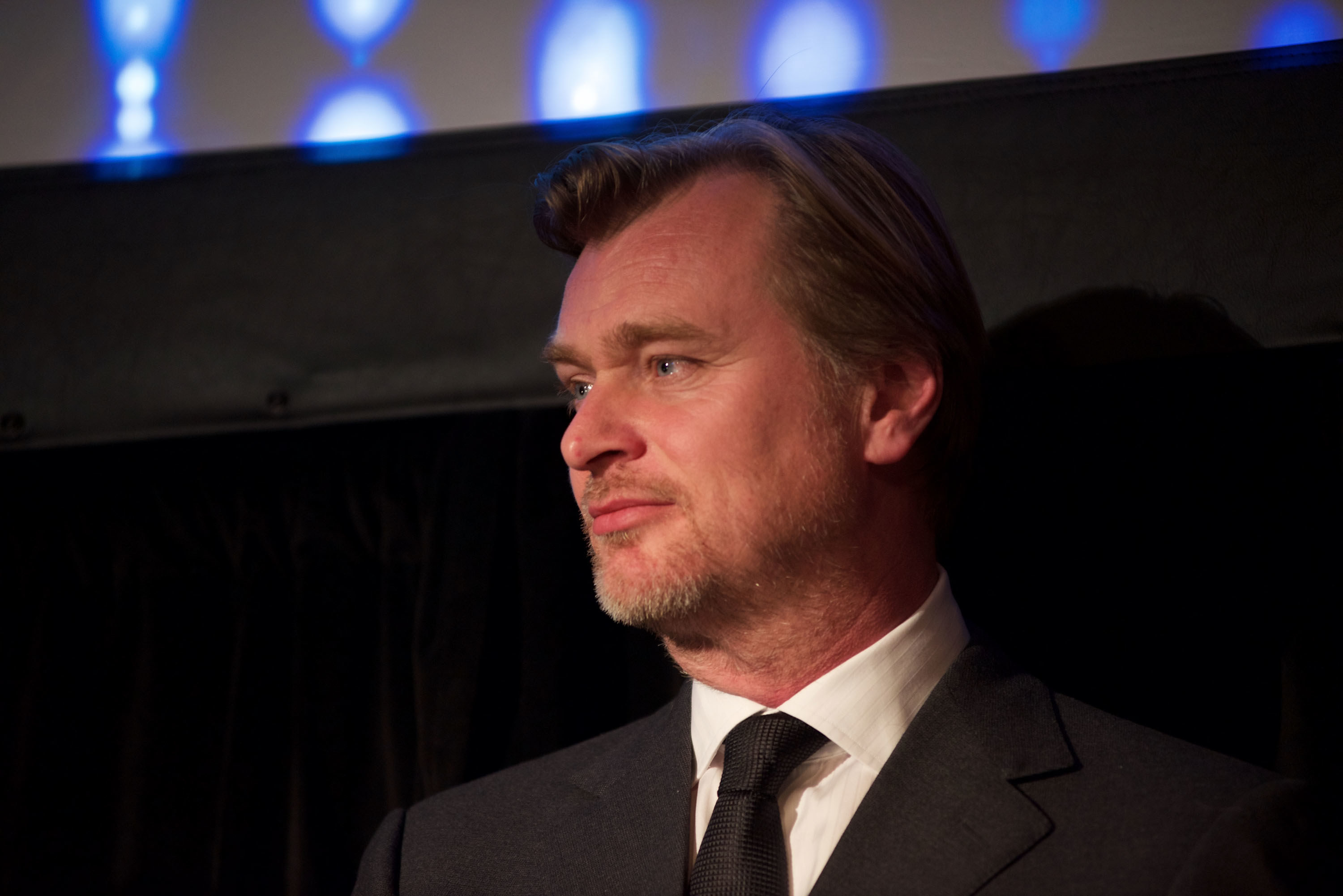 Christopher Nolan posing for a photo