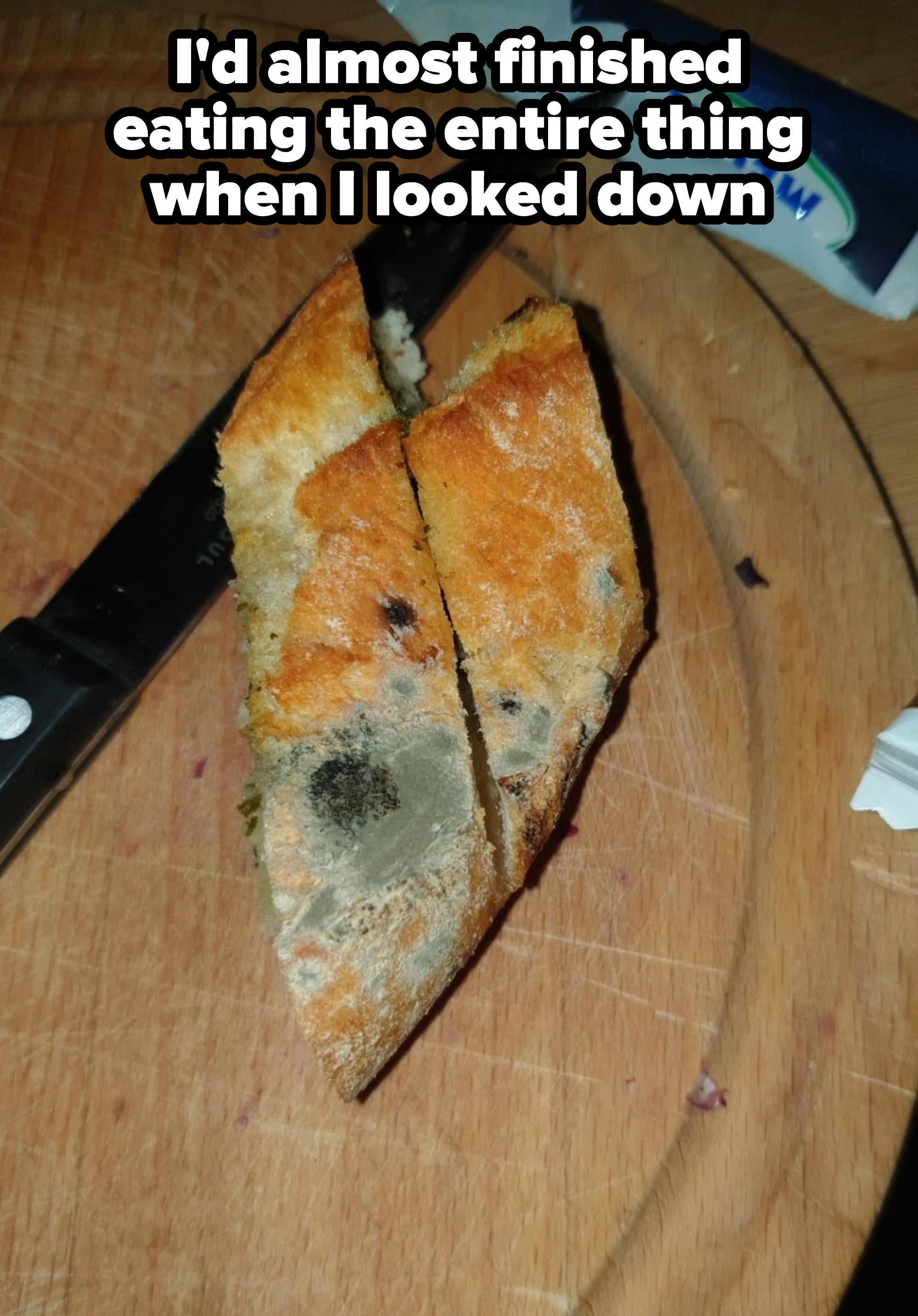 Moldy baguette with caption, &quot;I&#x27;d almost finished eating the entire thing when I looked down&quot;
