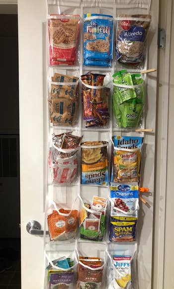 reviewer showing organizer hanging on pantry door holding various items