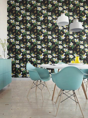 a kitchen scene with a black peel and stick wallpaper in the background that has white flowers on it