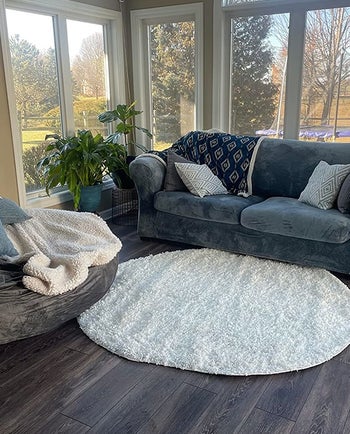 a couch with the stone blue cover over it