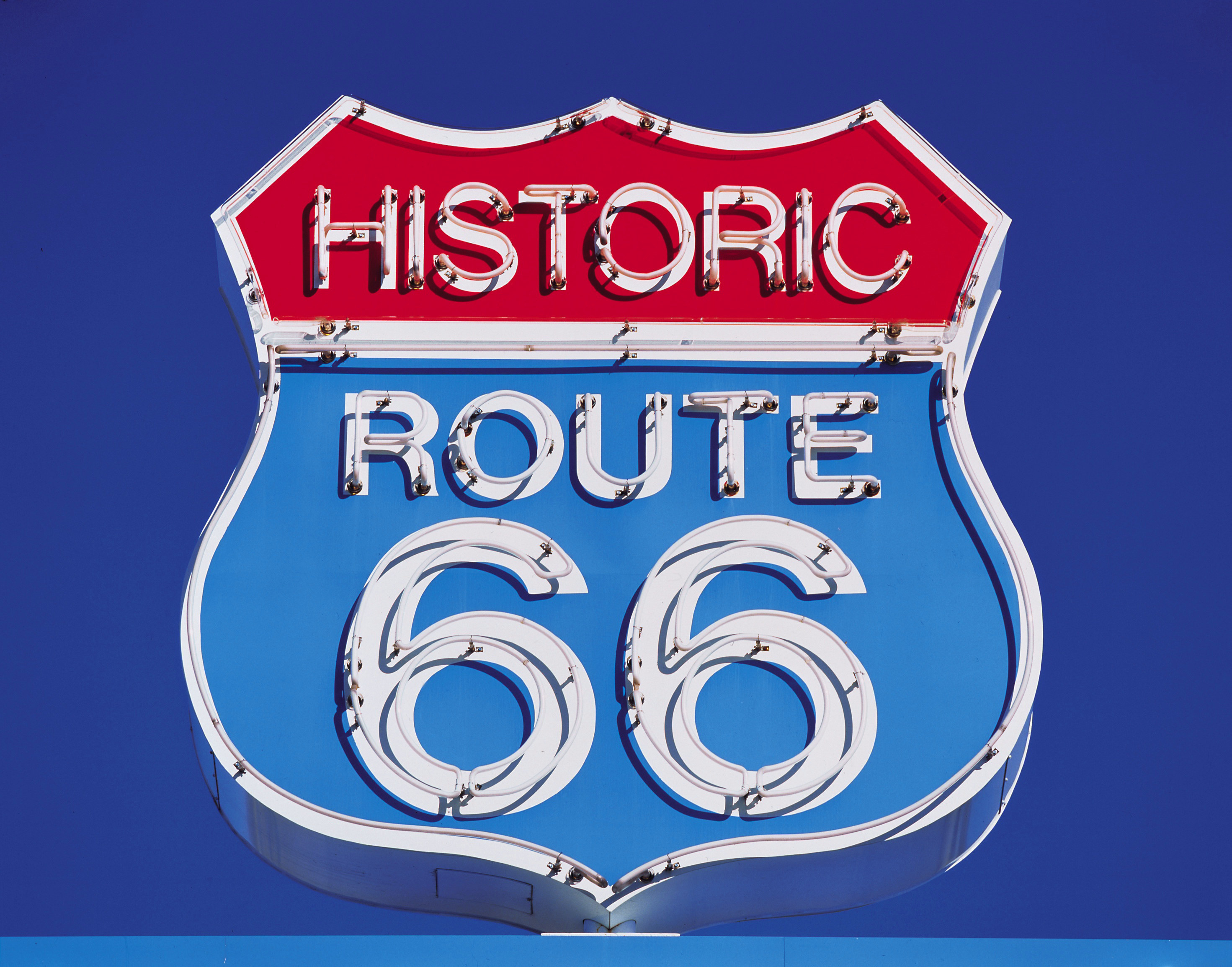 A red white and blue sign that reads Historic Route 66