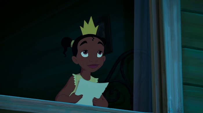 scene where young Tiana is looking out her window with a paper in her hand