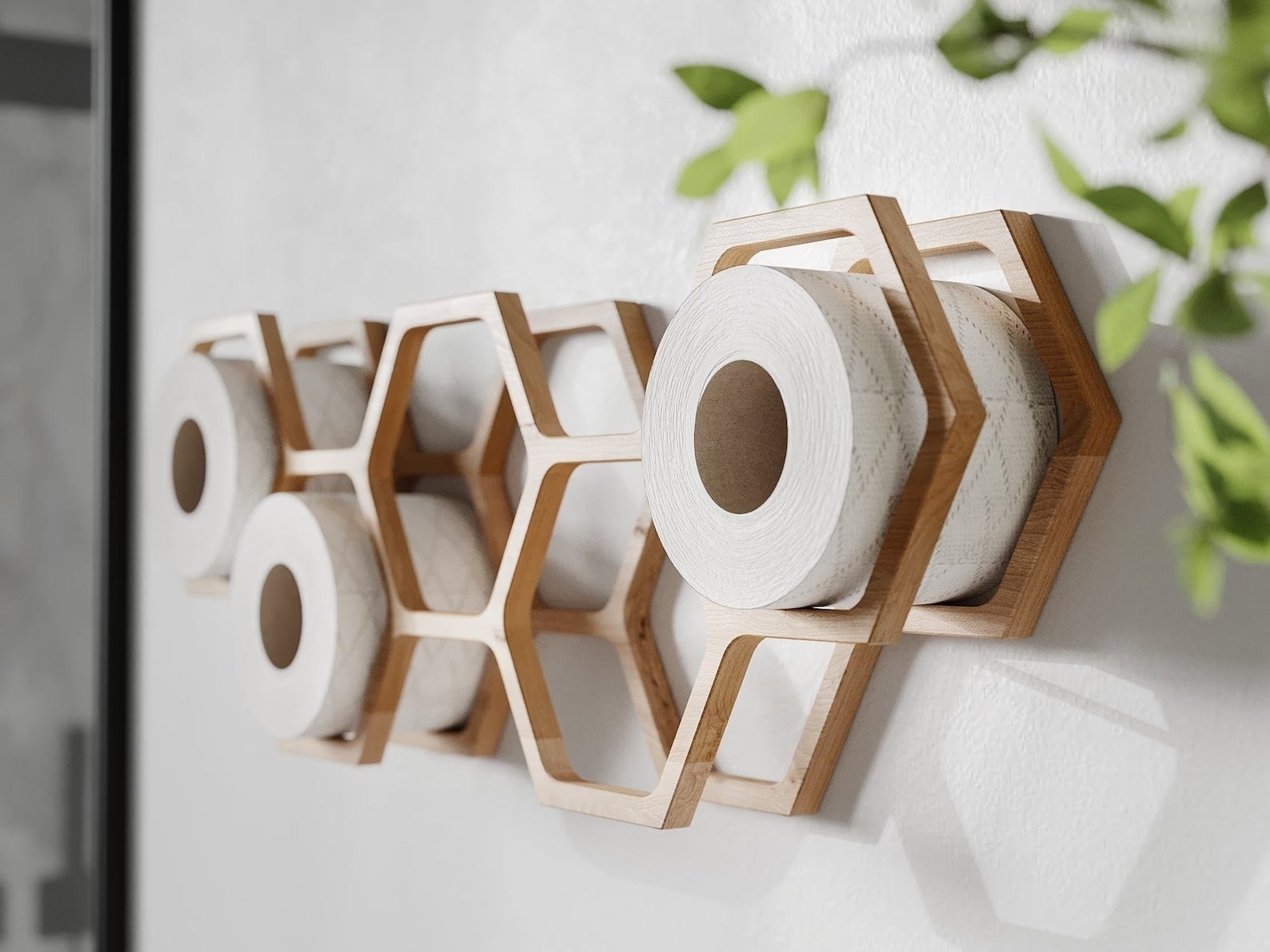 hexagonal shelf on wall holding rolls of toilet paper