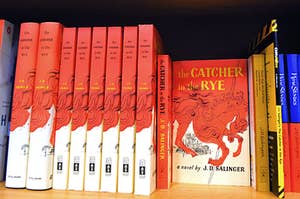 Copies of The Catcher in the Rye on a bookshelf