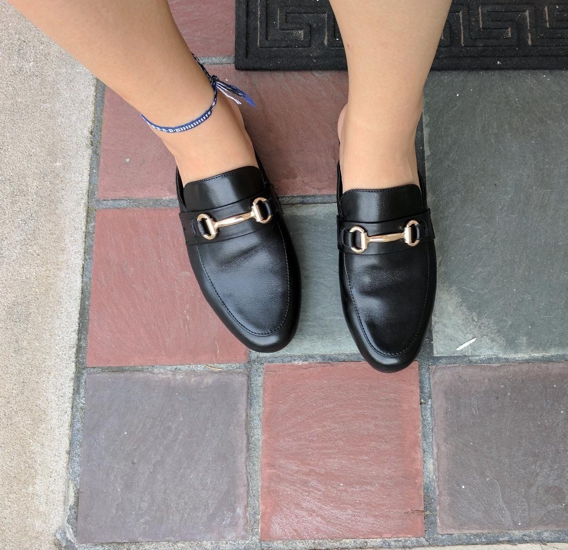 Reviewer wearing the black loafers