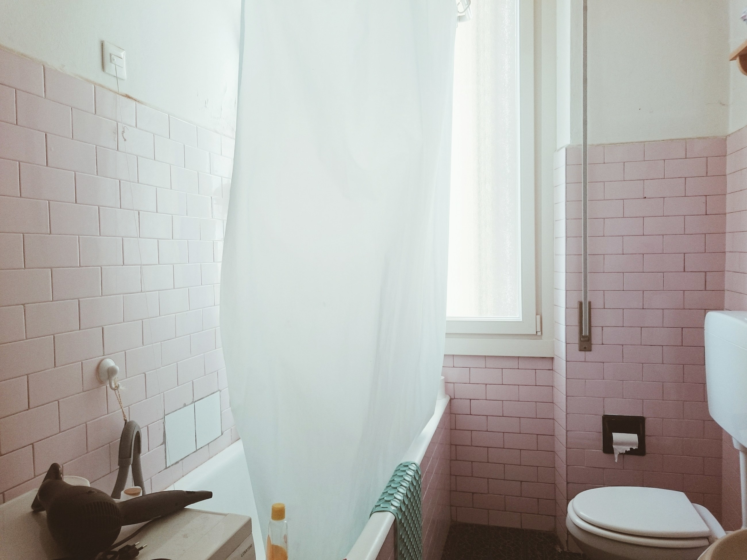 bathroom shower curtain lining the tub