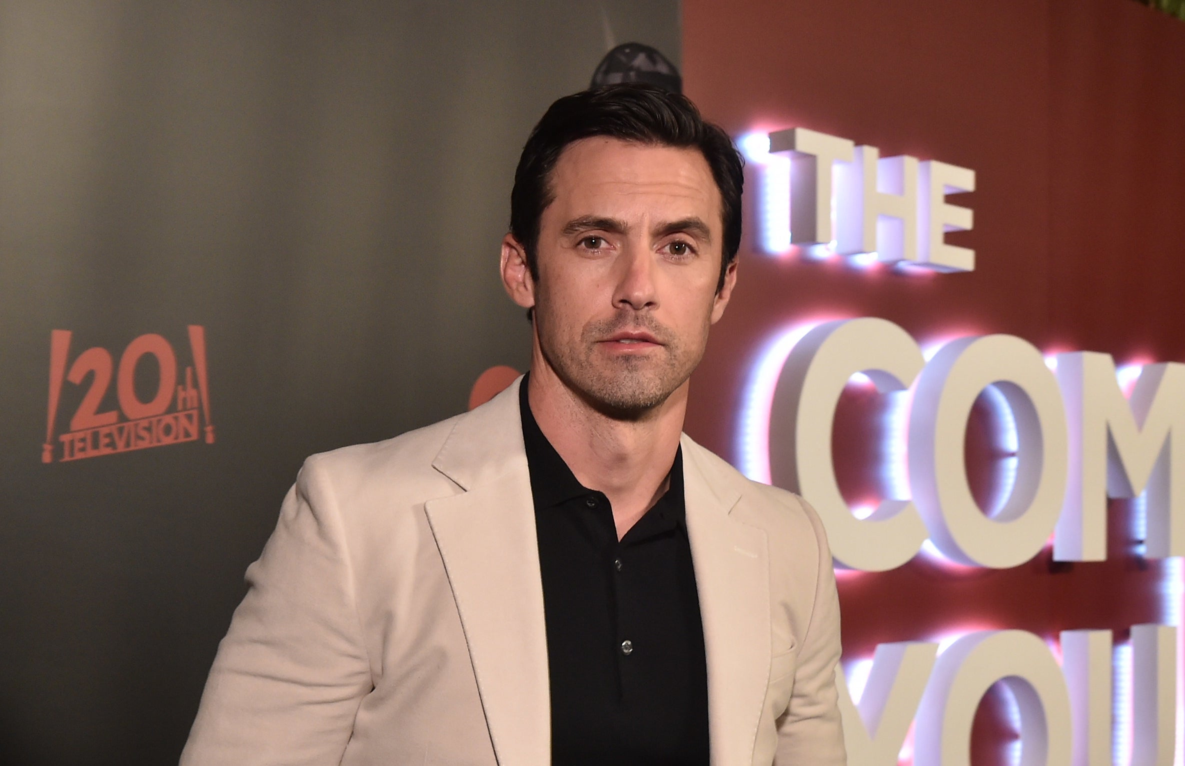 milo Ventimiglia in a beige suit