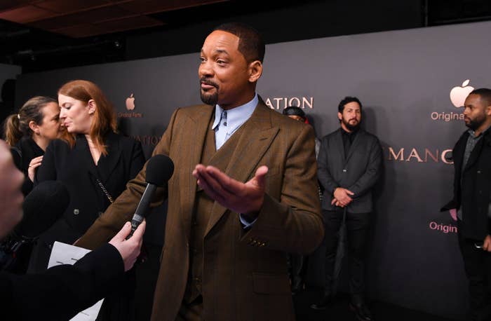 Will Smith gestures as he&#x27;s interviewed on the red carpet