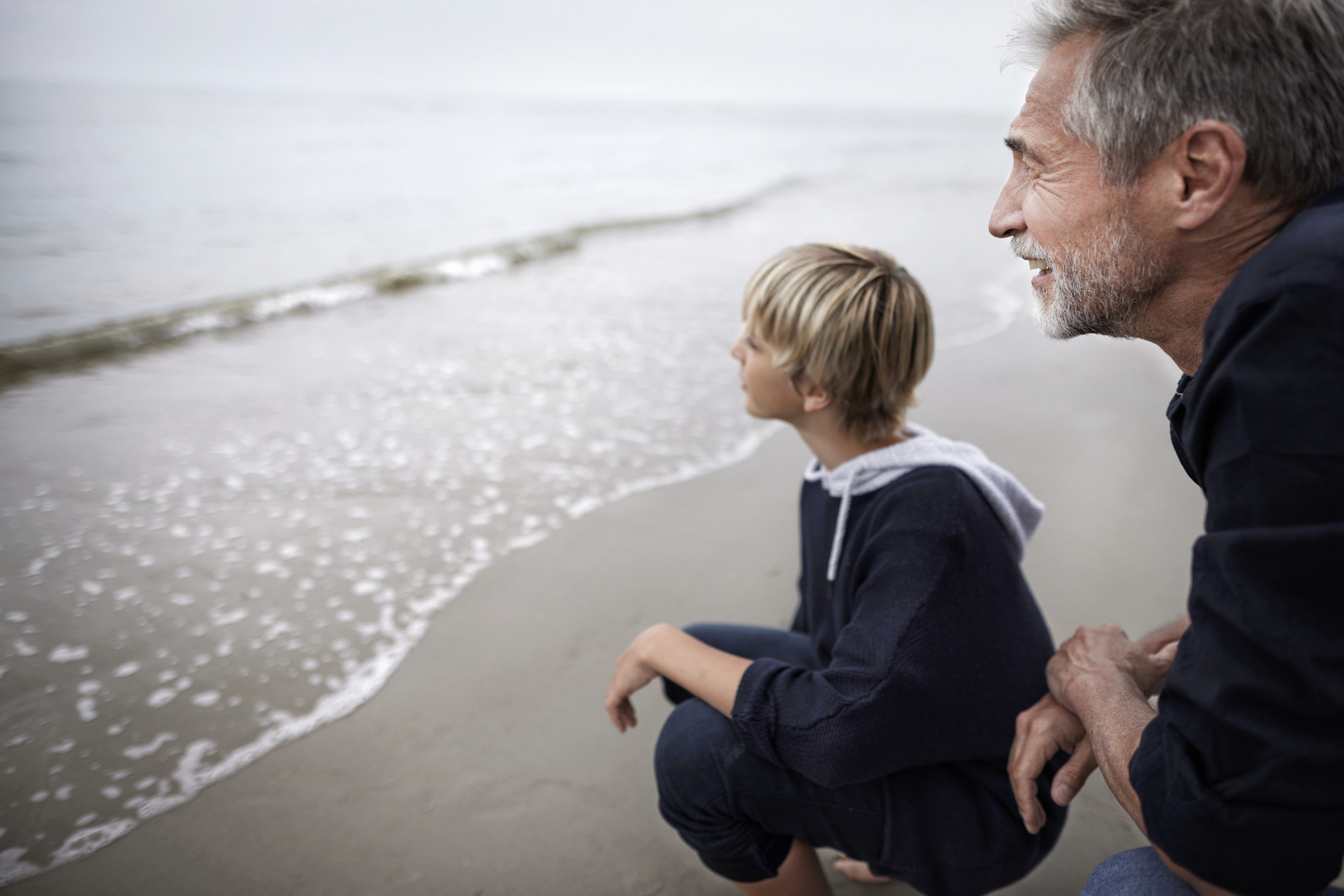 A grandpa and grandson on the beach