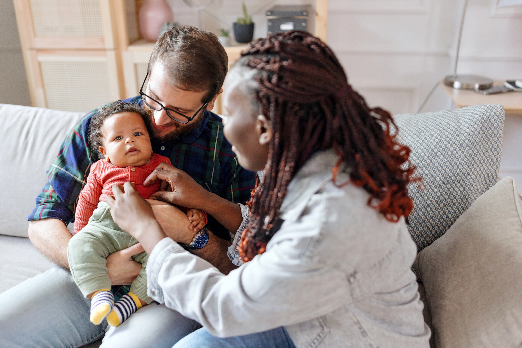 Parents playing with their baby