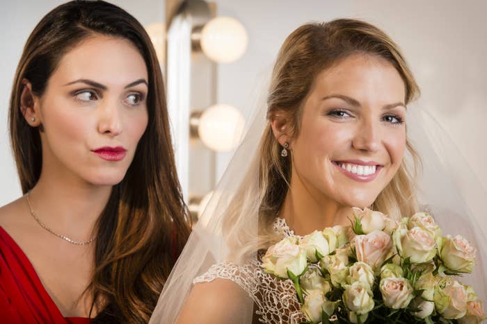 A bride and bridesmaid