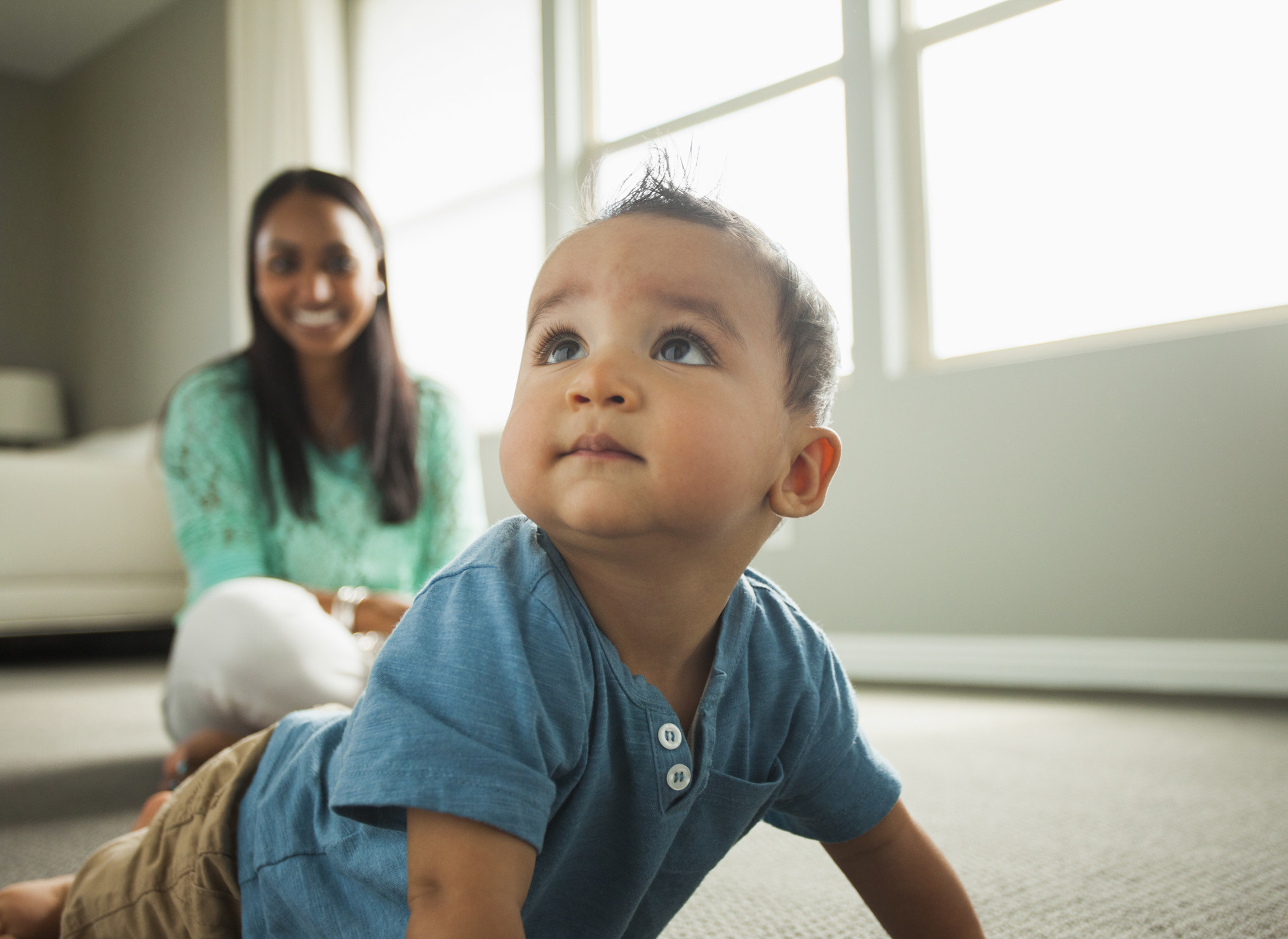 A baby crawling on the floor