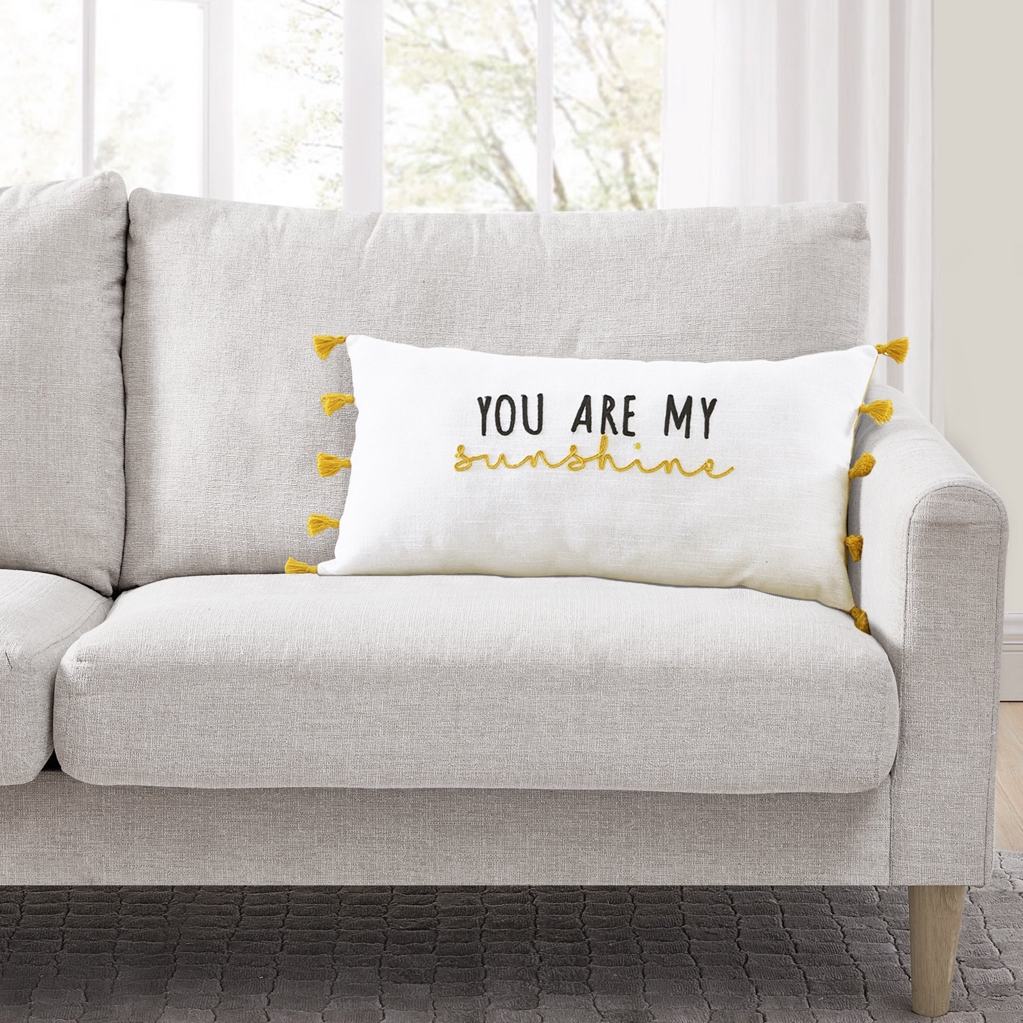 The &quot;you are my sunshine&quot; pillow on a couch