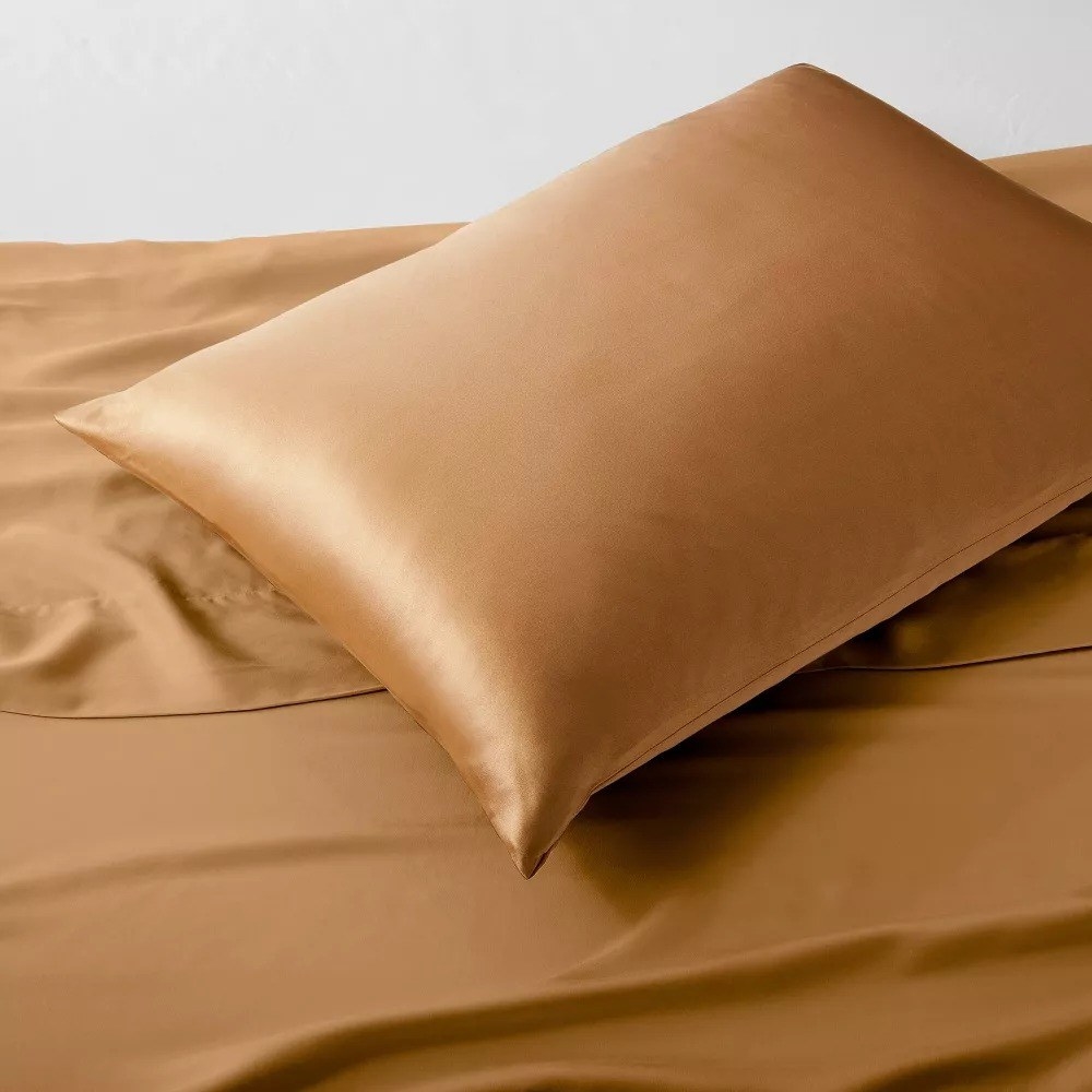 Silk pillowcase on matching sheets, linked to luxury bedding options