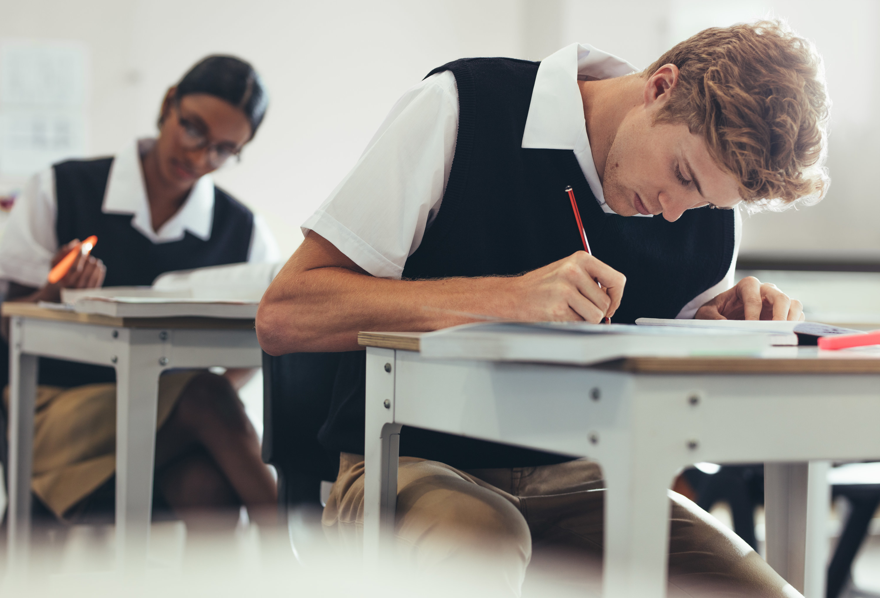 South African students working at their desks in uniforms