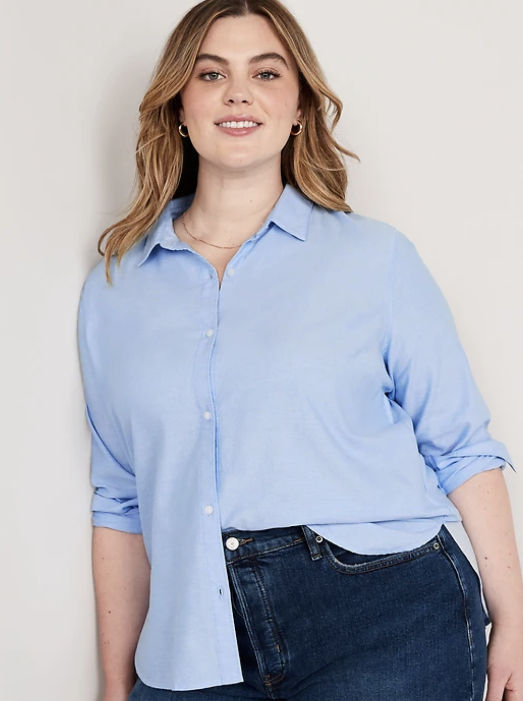 model wearing the shirt half French-tucked into their jeans