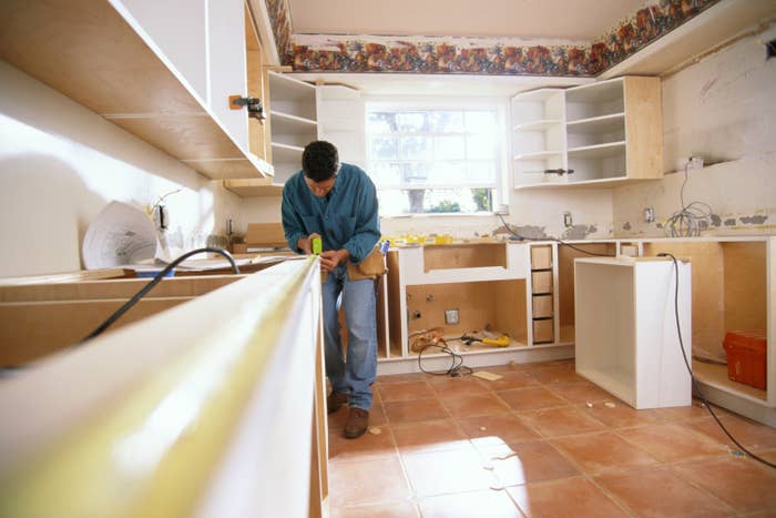 contracter working in a kitchen