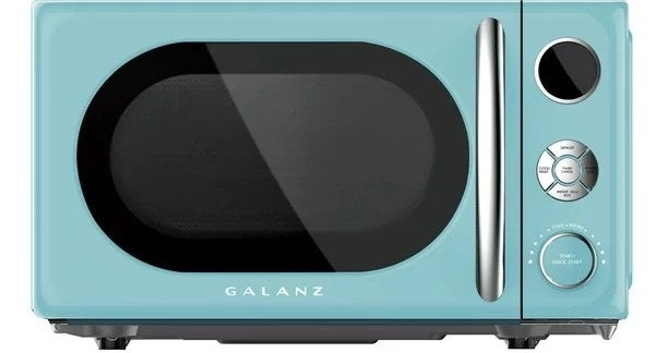 a blue retro microwave with metal handle