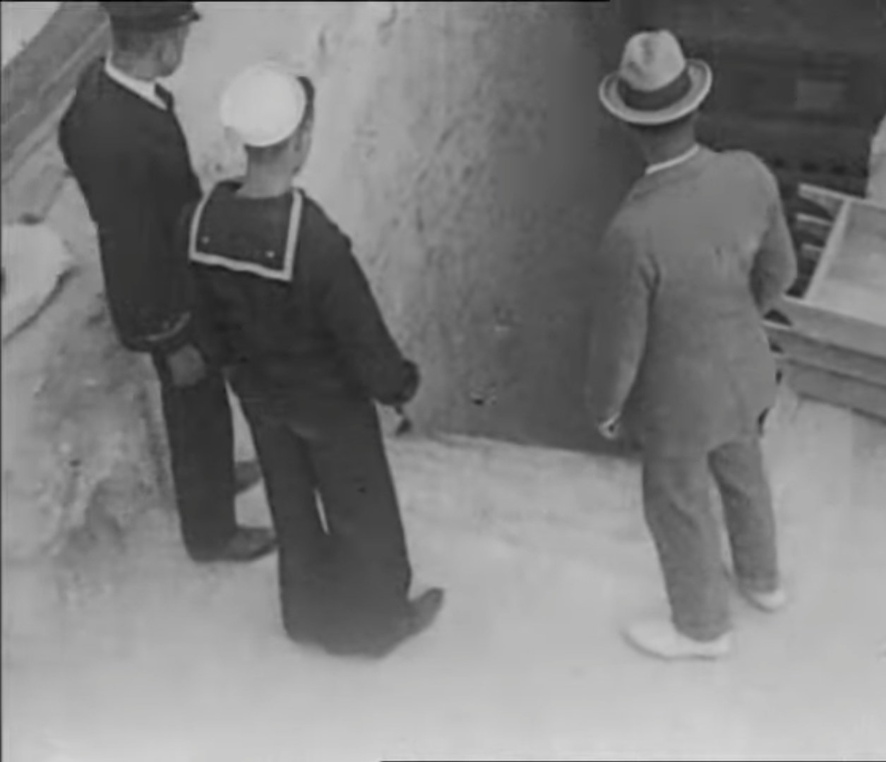 British men look down into the tomb of King Tut