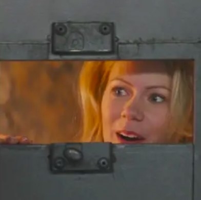 Princess Tilde looks through a gap in a door with a smile on her face