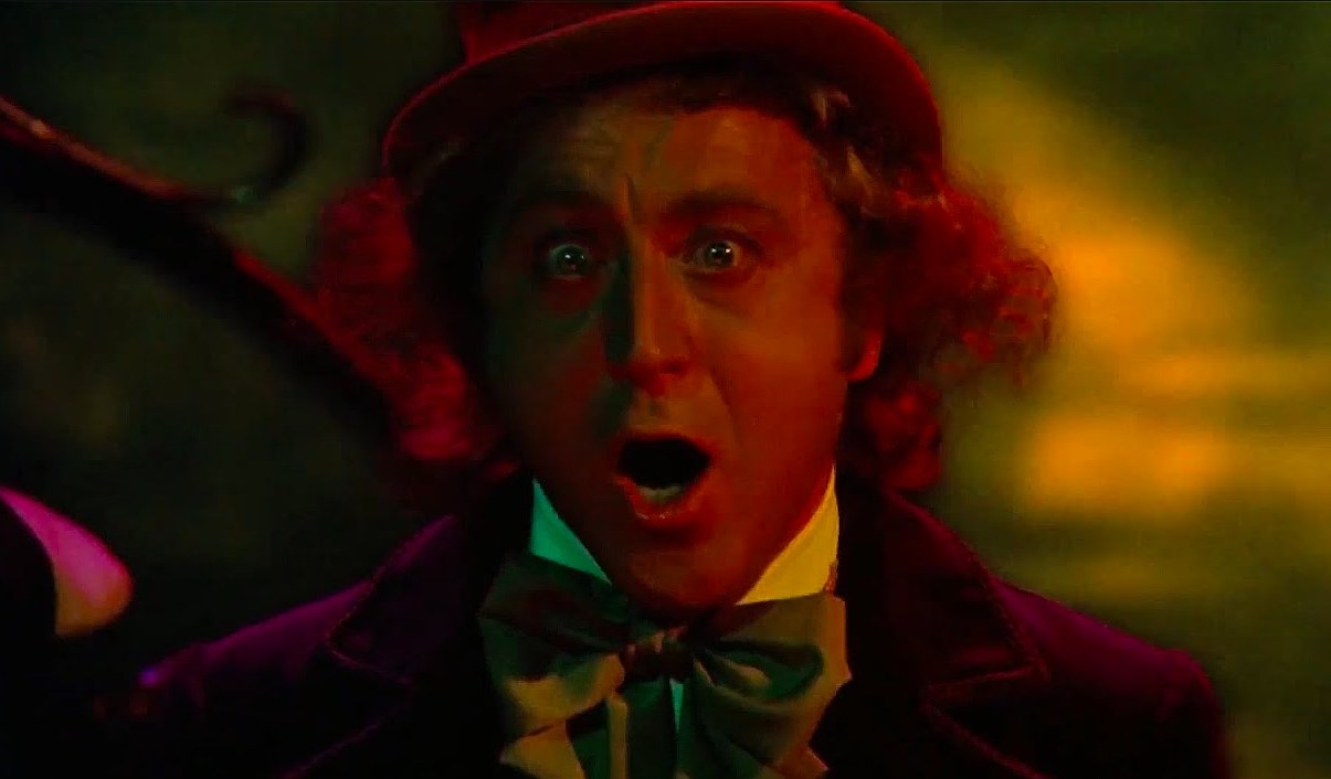 Willy Wonka yells maniacally under strange lighting