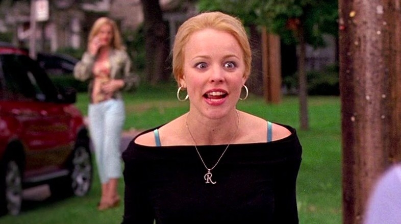 Regina George yells with wide eyes while standing in the street